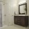 bathroom with a tub and bright lighting