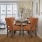 dining area with seating and bright lighting from nearby patio doors
