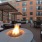 outdoor courtyard area with a firepit, lounge seating and spacious areas