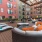 outdoor courtyard area with a firepit, lounge seating and spacious areas