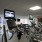 fitness center rendering showing plenty of equipment and modern decor in a large, spacious room